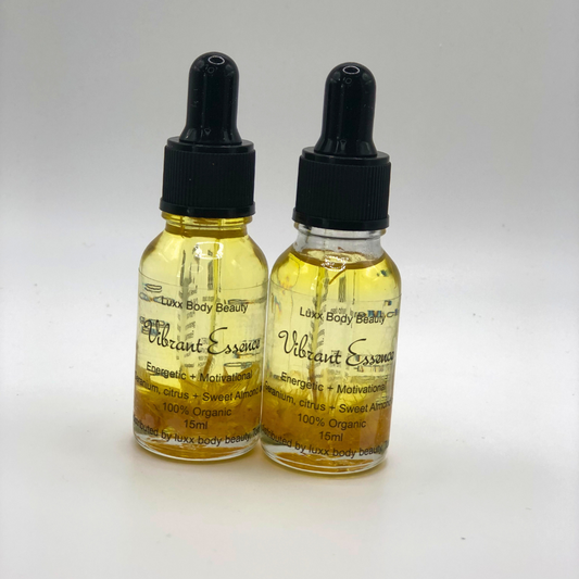 A small clear bottle with a dropper, containing body oil infused with witch hazel flower.