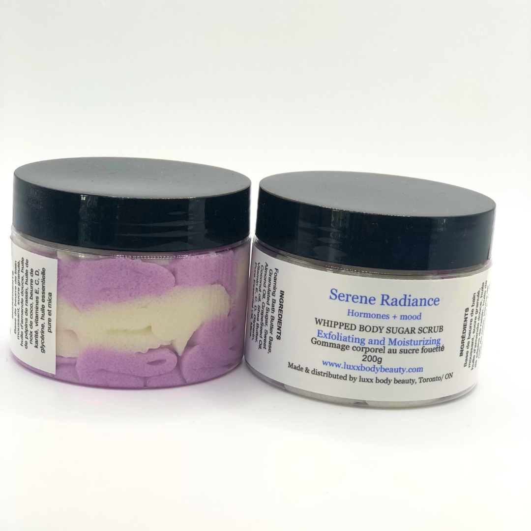 A whipped foamy sugar scrub in a clear jar is made of white and purple layers