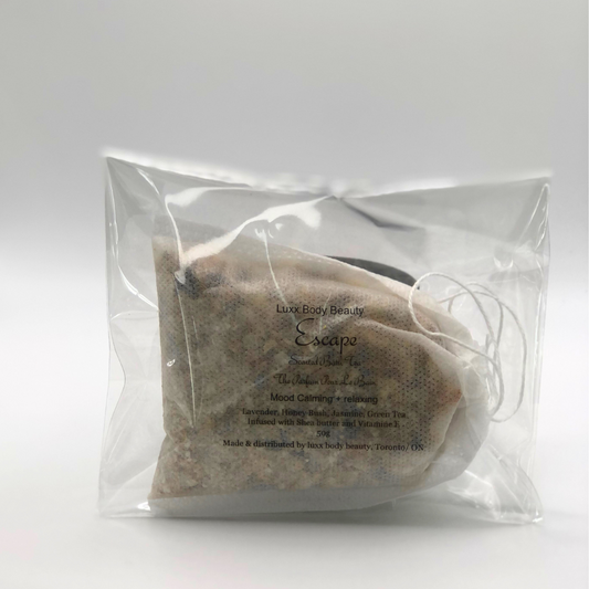 A clear bag filled with a sachet of perfumed natural botanical ingredients for a tea bath.