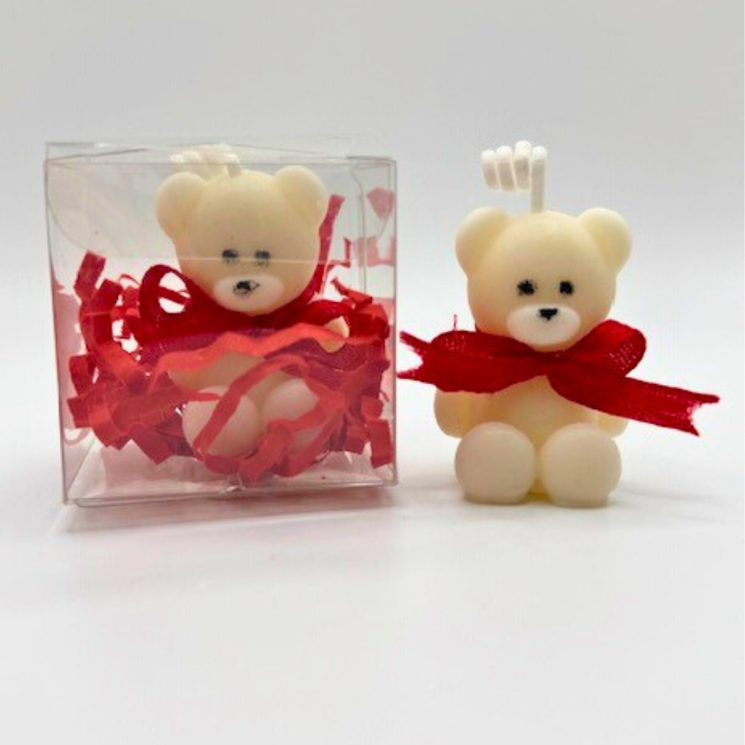 A white teddy bear candles with red bow ribbon around the neck. One of the candle is in a clear box. A perfect gift for Valentine's Day