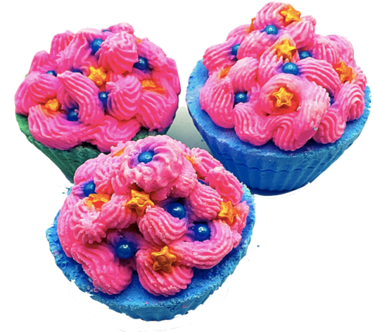 A blue cupcake-shaped bath bomb topped with pink bubble bath icing, topped with blue pearls and golden stars.