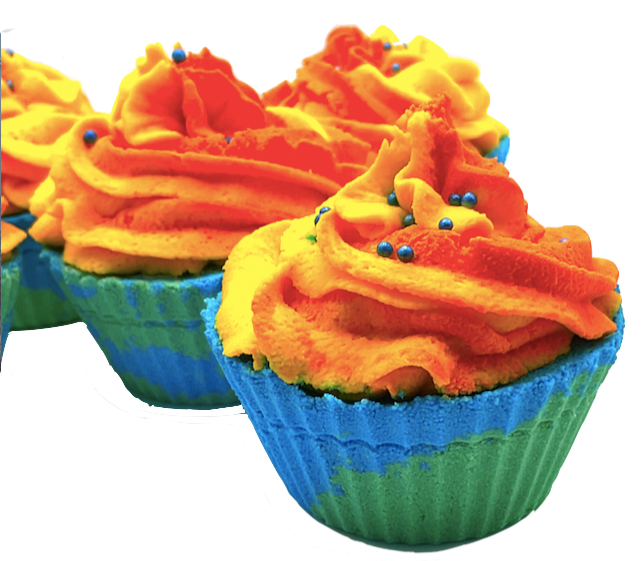 A blue and green cupcake-shaped bath bomb topped with orange and yellow bubble bath icing, topped with blue pearls.