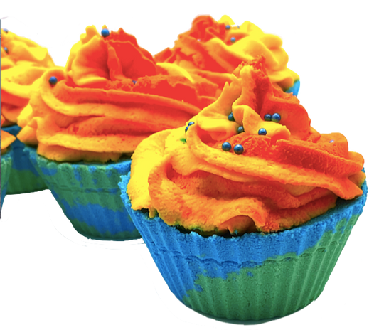 A blue and green cupcake-shaped bath bomb topped with orange and yellow bubble bath icing, topped with blue pearls.