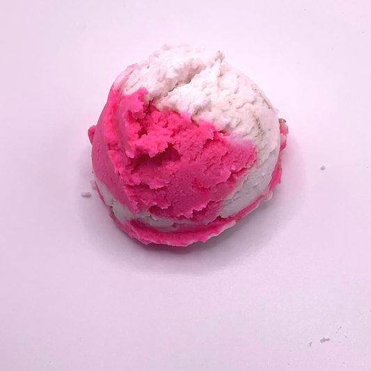 An ice cream scoop-shaped bubble bath in pink and white.