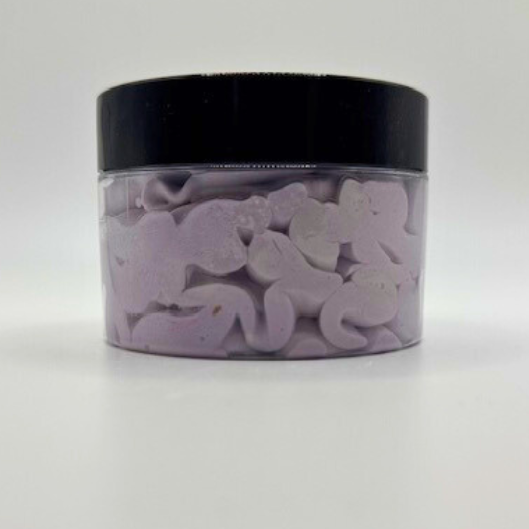 A clear container with a black-led containing light purple colour body butter