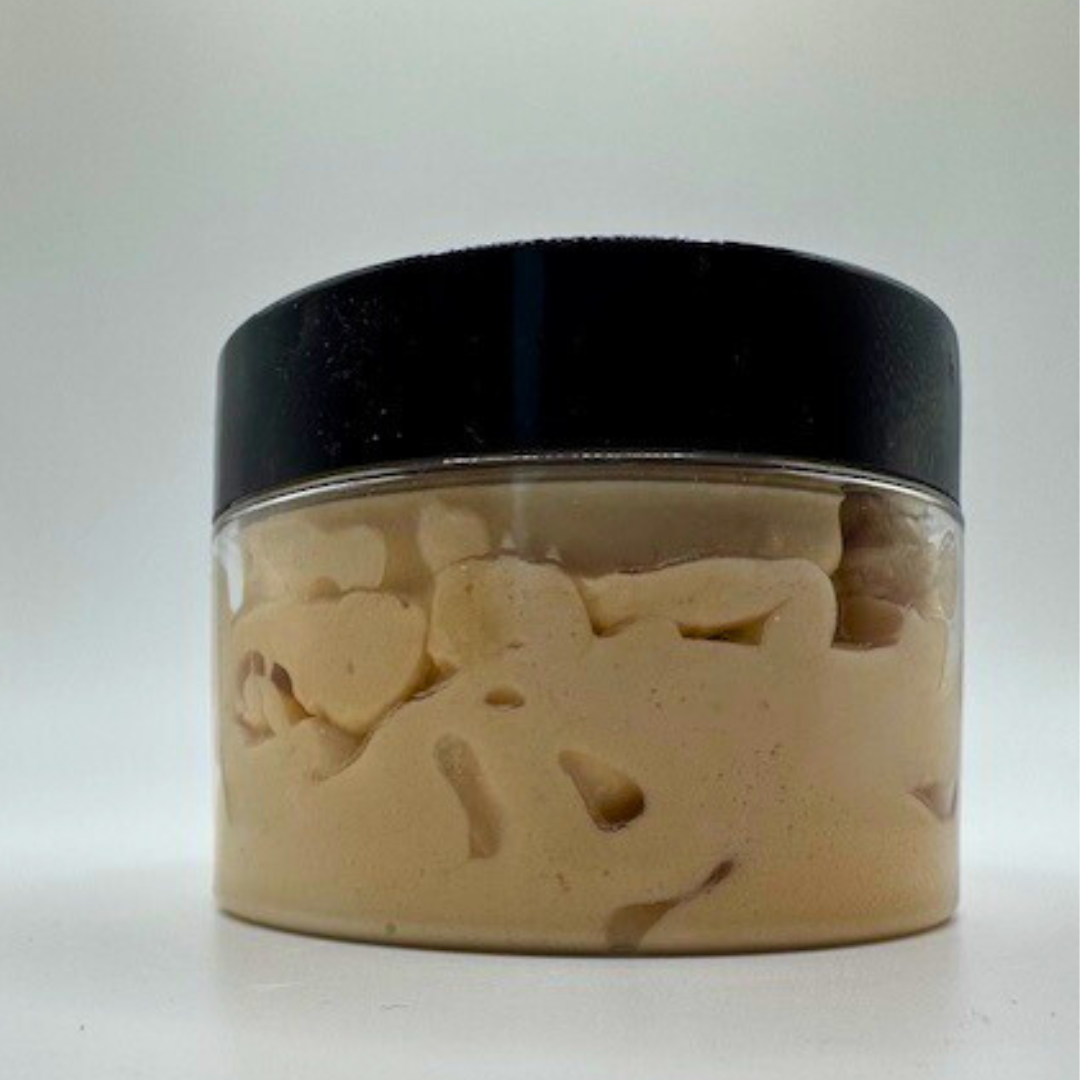 A clear container with a black-led containing golden colour body butter