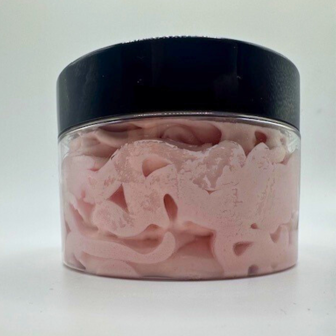 A clear container with a black-led containing pink colour body butter